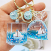 Wholesale Acrylic Plastic Cartoon Beach Nautical Drift Bottle Keychain Tourist Souvenir Sailboat Liquid Oil Ocean Keychain